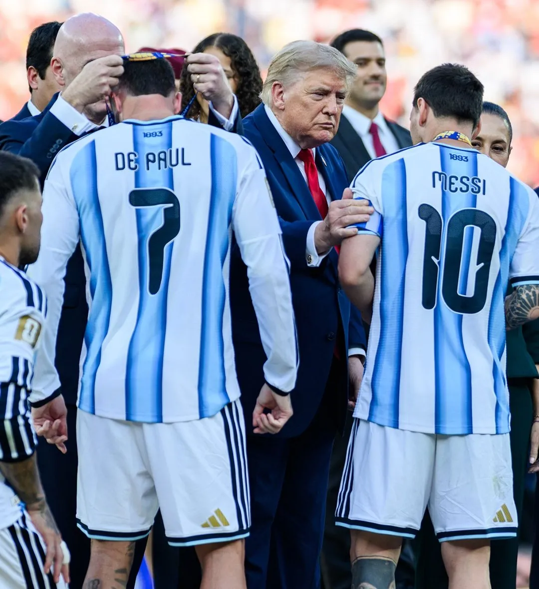 Messi and De Paul, in Argentina shirts, receive their runners-up medals after the 2026 final